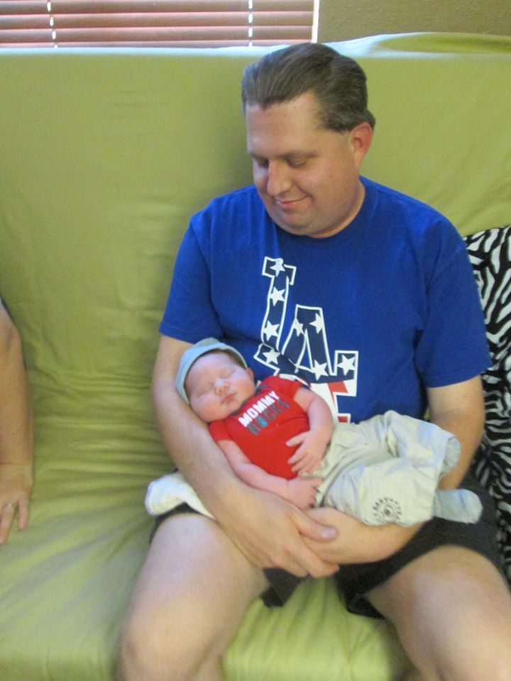 Jon holding Patrick for the first time.