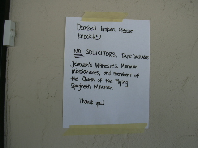 The sign by our door.