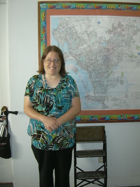 Me posing in front of a map of the San Diego area.