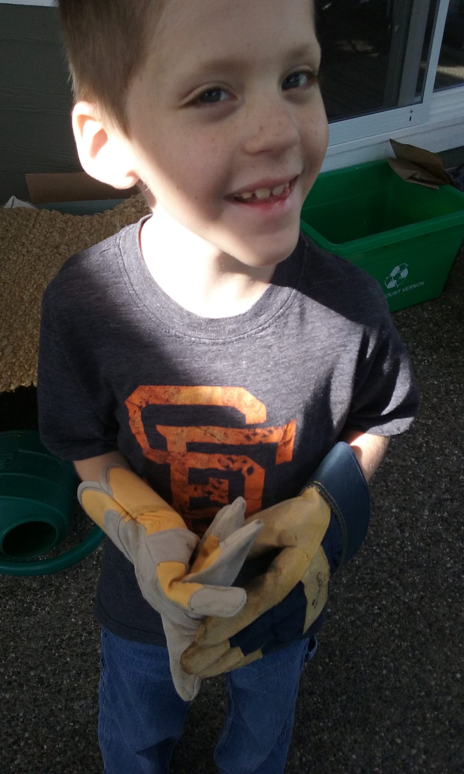 Daniel helping with the yard.